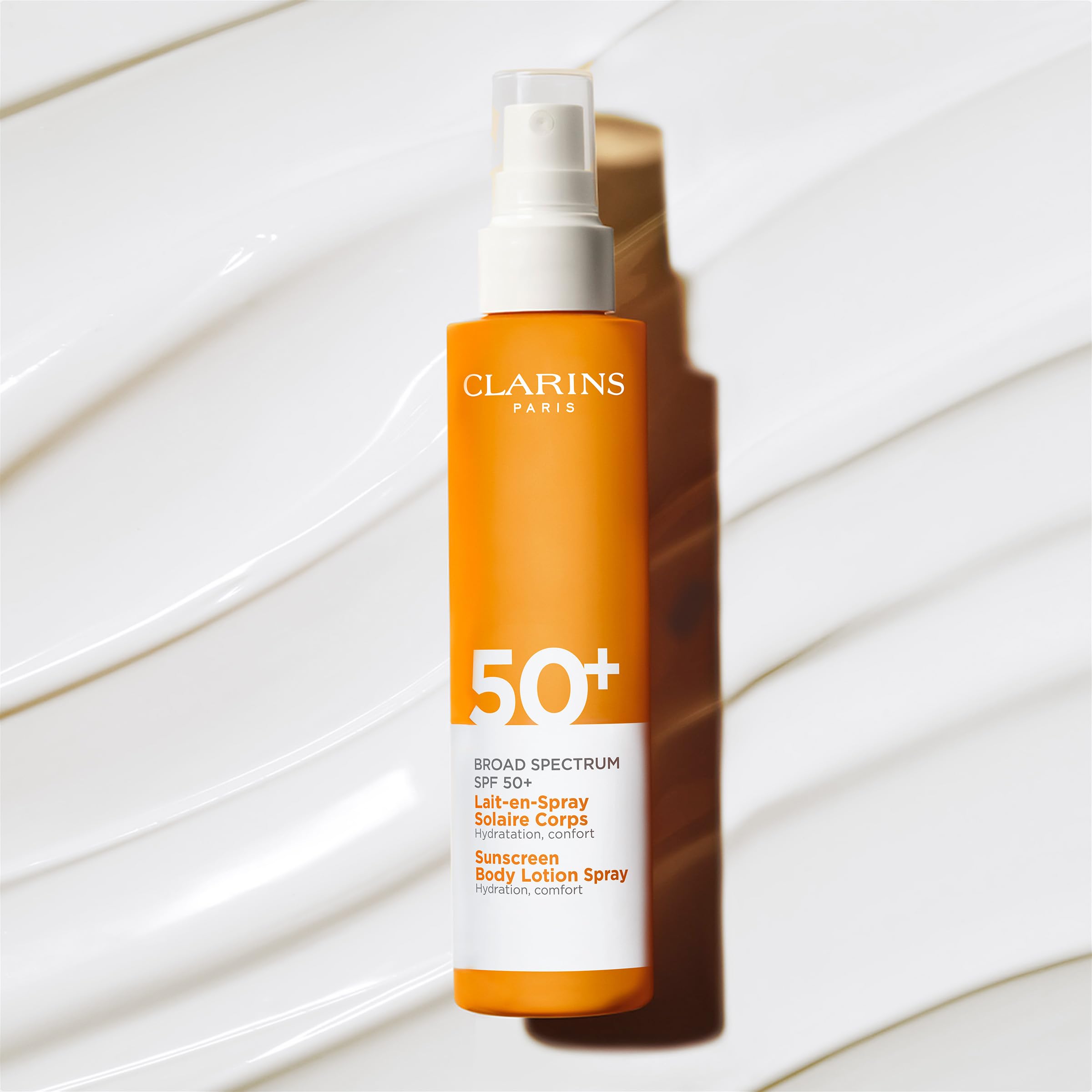 Clarins Body Sunscreen Lotion Spray | Broad Spectrum SPF 50+ | UVA/UVB Protection | Lightweight and No White Cast | Enriched with Antioxidants | All Skin Types, including Sensitive Skin | 5 Ounces